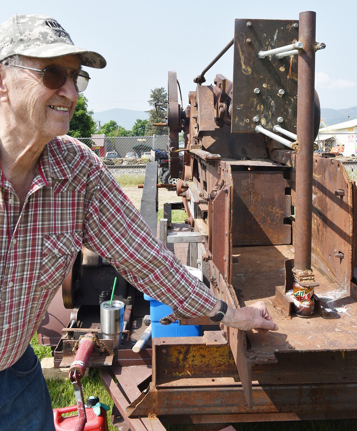 AT LEFT, Bob Mayes of Paradise shows off his handy aluminum can crusher, repurposed from a stationary hay baler from the 1920s or &#145;30s.