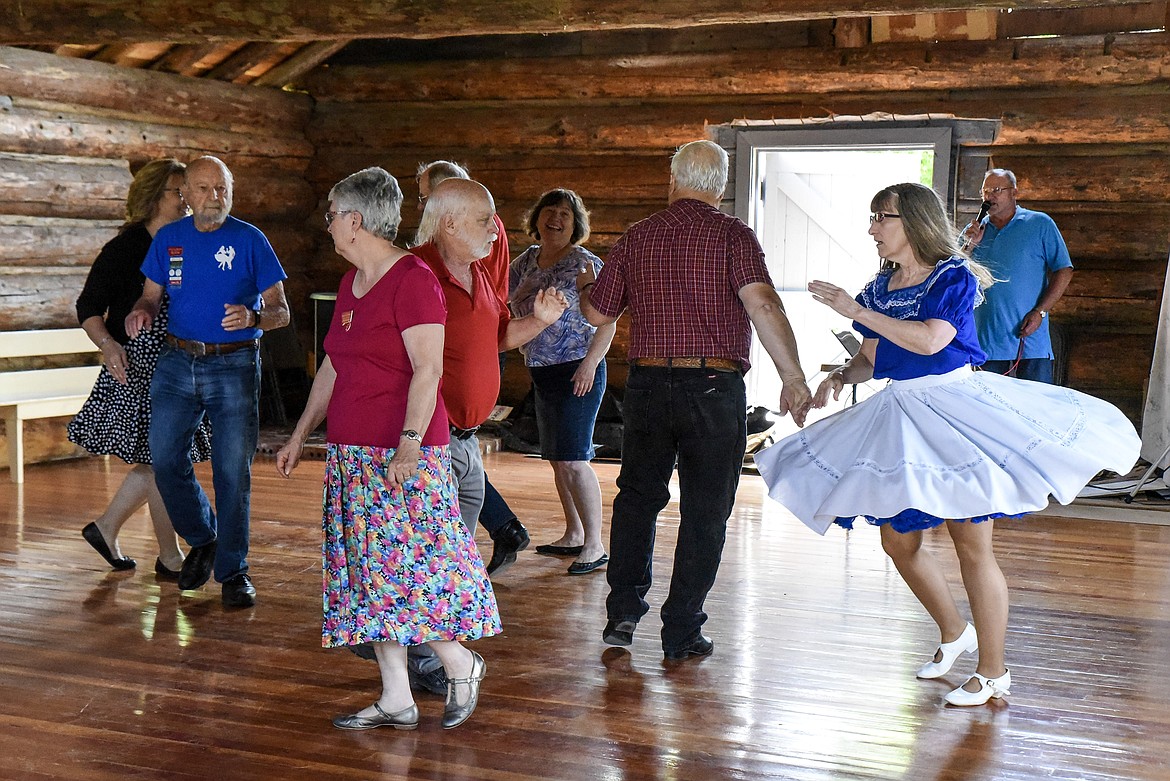 Rick Utter, from Bonners Ferry, calls the dance for the Libby Spinning Squares at the Heritage Museum&#146;s Opening Day in Libby Saturday. (Ben Kibbey/The Western News)