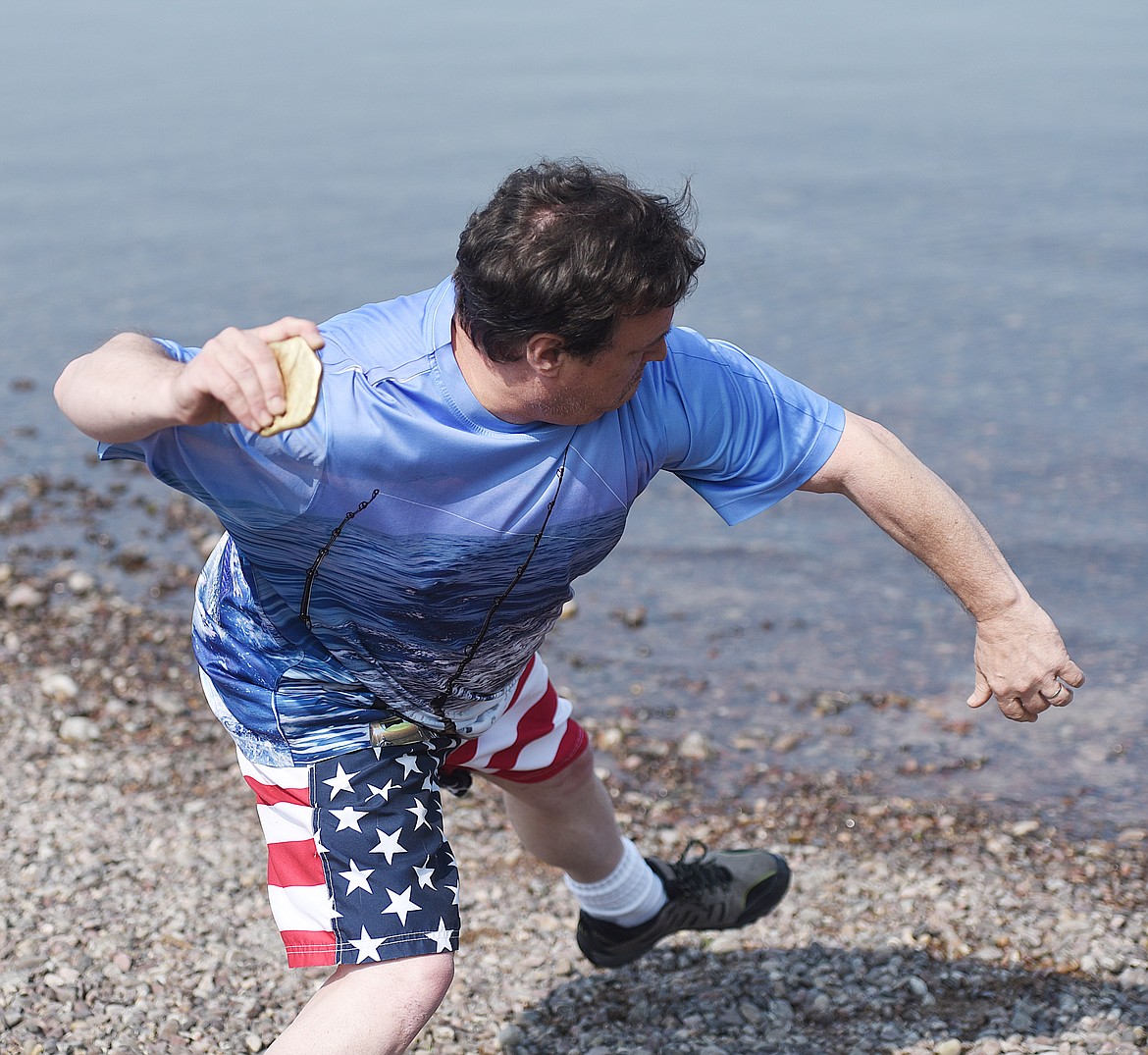 CARLO ADRIGNOLA, who was visiting the Mission Valley from his home in Humble, Texas, goes all in on a throw during the Rock Skipping Championship. His best was 20 skips, good for a tie for the 13 &amp; over title with his brother, Tom Adrignola of Columbia Falls.