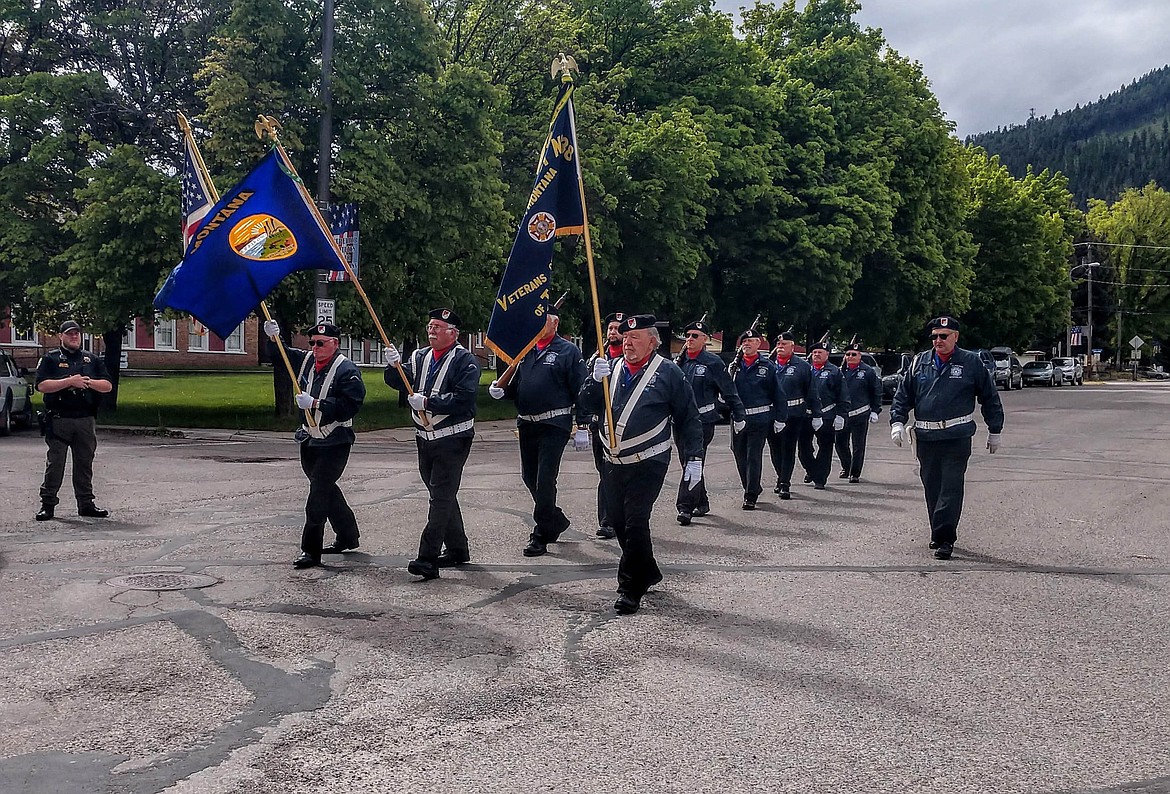 SQUAD LEADER Ed Heppe leads fellow members Doug Cummings, Doug Pugh, Herman Berne King, Chuck Case, Steve Tull, Aaron Winter, Dan Arnson, Tim Wilkerson, Ken Quitt, Ron Anderson and bugler Jim Debree in Superior on Monday, May 27. (Courtesy photo)