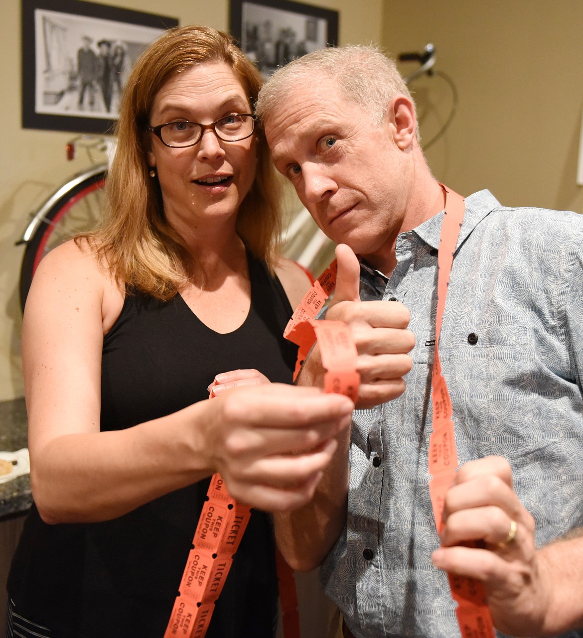 MICHELLE AND Devin Huntley of Polson were in the mood to support the Mission Valley Christian Academy On Eagle&#146;s Wings fundraiser by purchasing lots of 50/50 tickets. (Joe Sova photos/Lake County Leader)