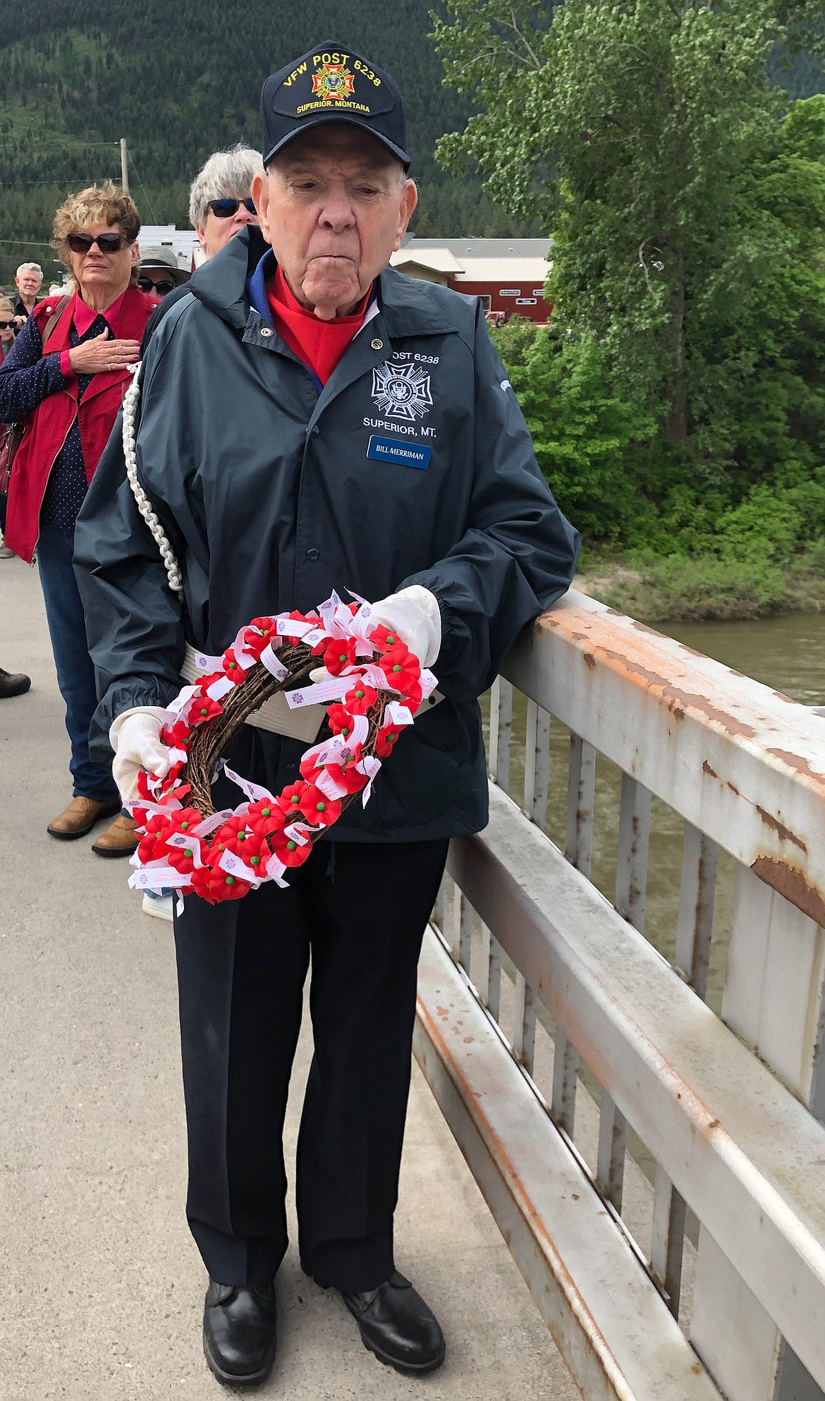 BILL MERRIMAN prepares to drop the traditional poppy wreath in the river at Superior&#146;s Memorial Day services. (Courtesy photo)