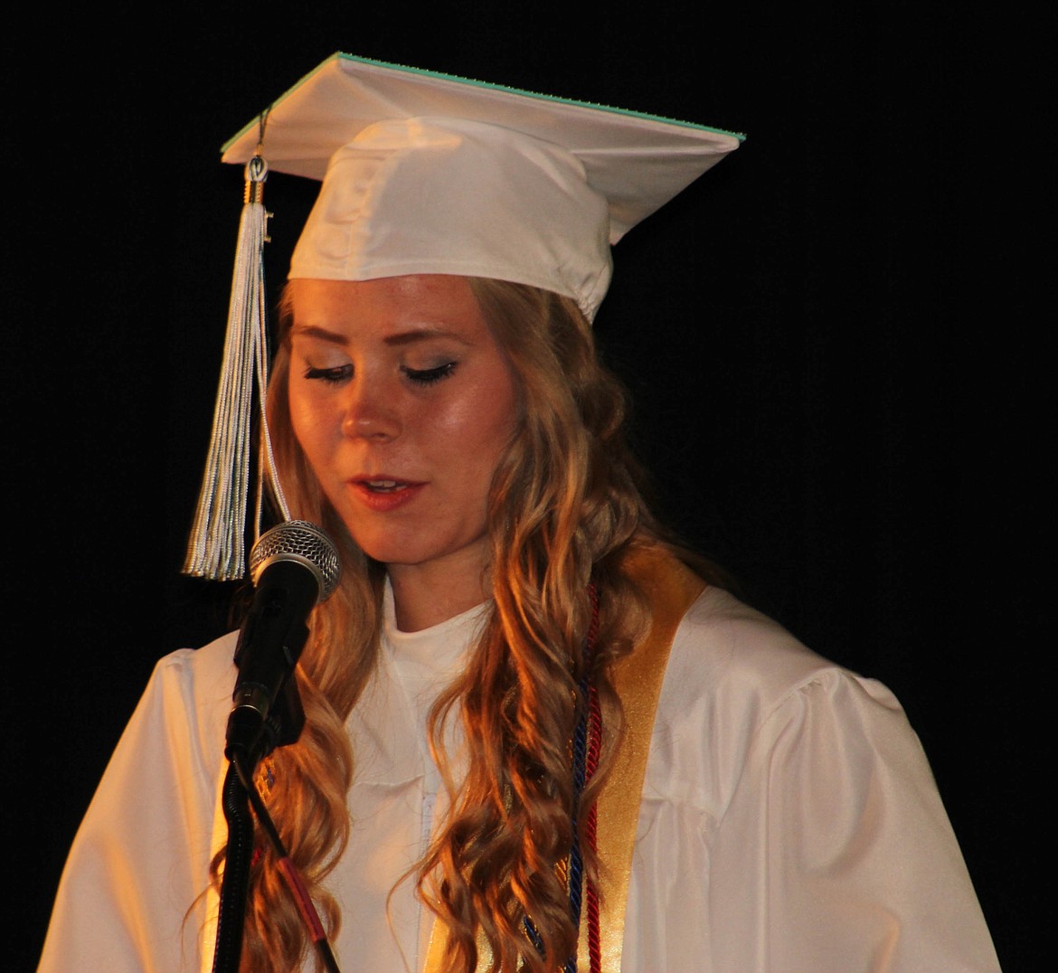 SALUTATORIAN EMMA Hill speaks to the audience at the St. Regis graduation ceremony on Sunday, May 26 in the school gymnasium.