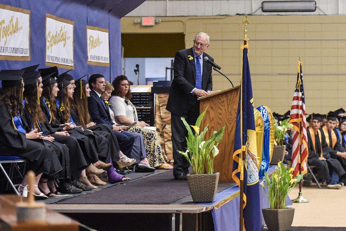 Commencement speaker Roe Hatlen addresses the Libby High School&#146;s valedictorians and salutatorian Saturday at Libby&#146;s graduation. (Ben Kibbey/The Western News)
