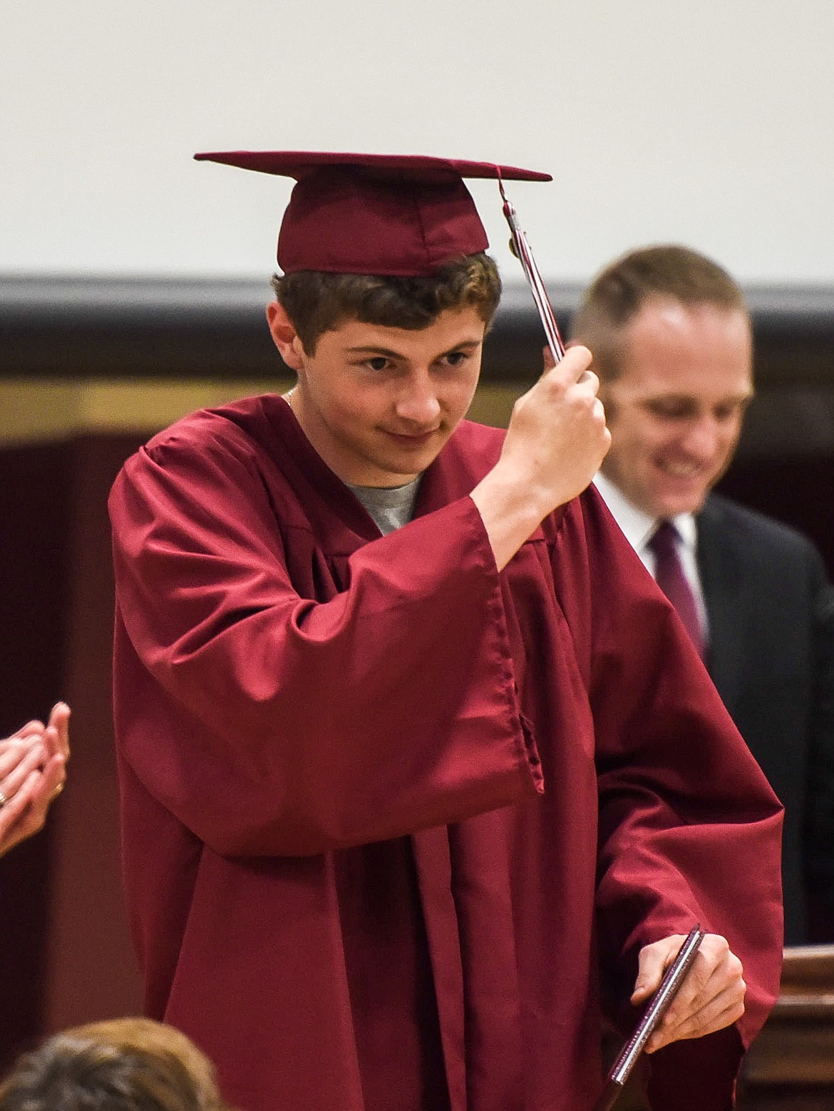 Hunter Leighty moves his tassel after receiving his diploma, Saturday at the Troy High School graduation at the Troy Activity Center. (Ben Kibbey/The Western News)
