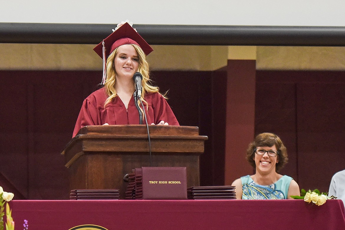 Troy High School&#146;s Paige Chapel introduces honorary speaker &#151; and Troy Spanish teacher &#151; Tabitha Maust, Saturday at Troy&#146;s graduation at the Troy Activity Center. (Ben Kibbey/The Western News)