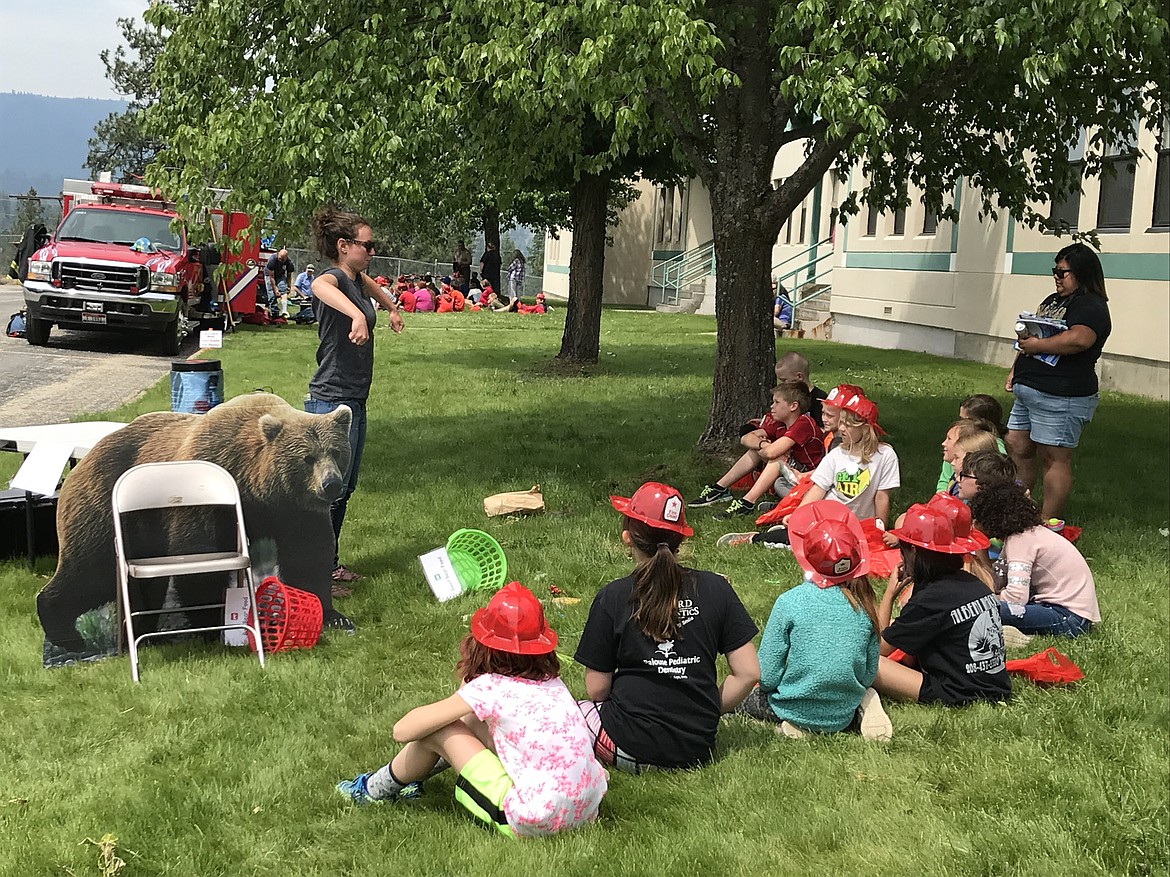 (Courtesy photo)
Kalispel Tribe officials talk to students at Idaho Hill Elementary&#146;s recent end-of-the-year Safety Day.