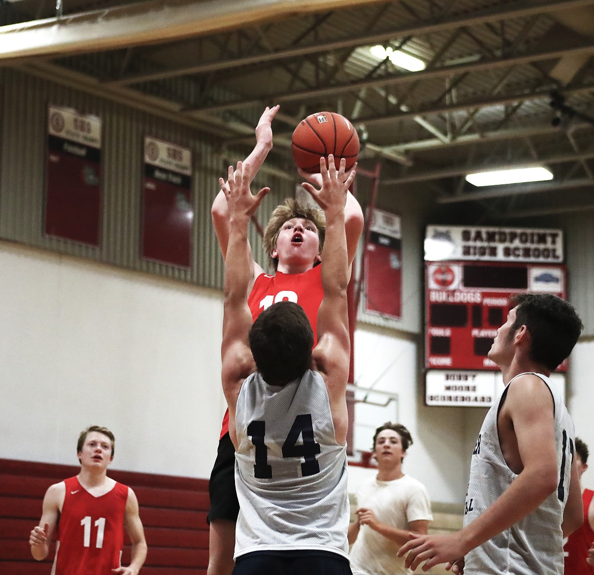 (Photo by KYLE CAJERO)
Sandpoint&#146;s Jacob Eldridge shoots over Bonners Ferry&#146;s Ty Bateman in a varsity scrimmage on June 18.