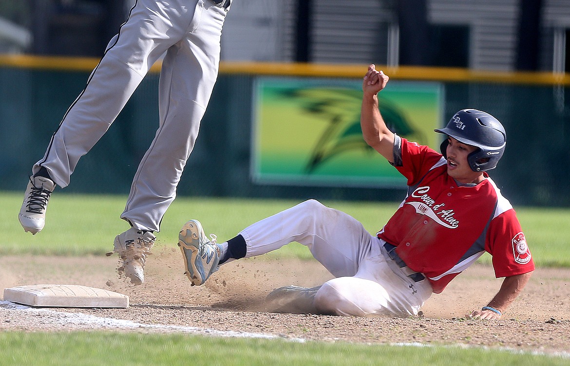 Coeur d&#146;Alene Lumberman Dylan Brum slides safely into third base in a game against the Northern Lakes Mountaineers.