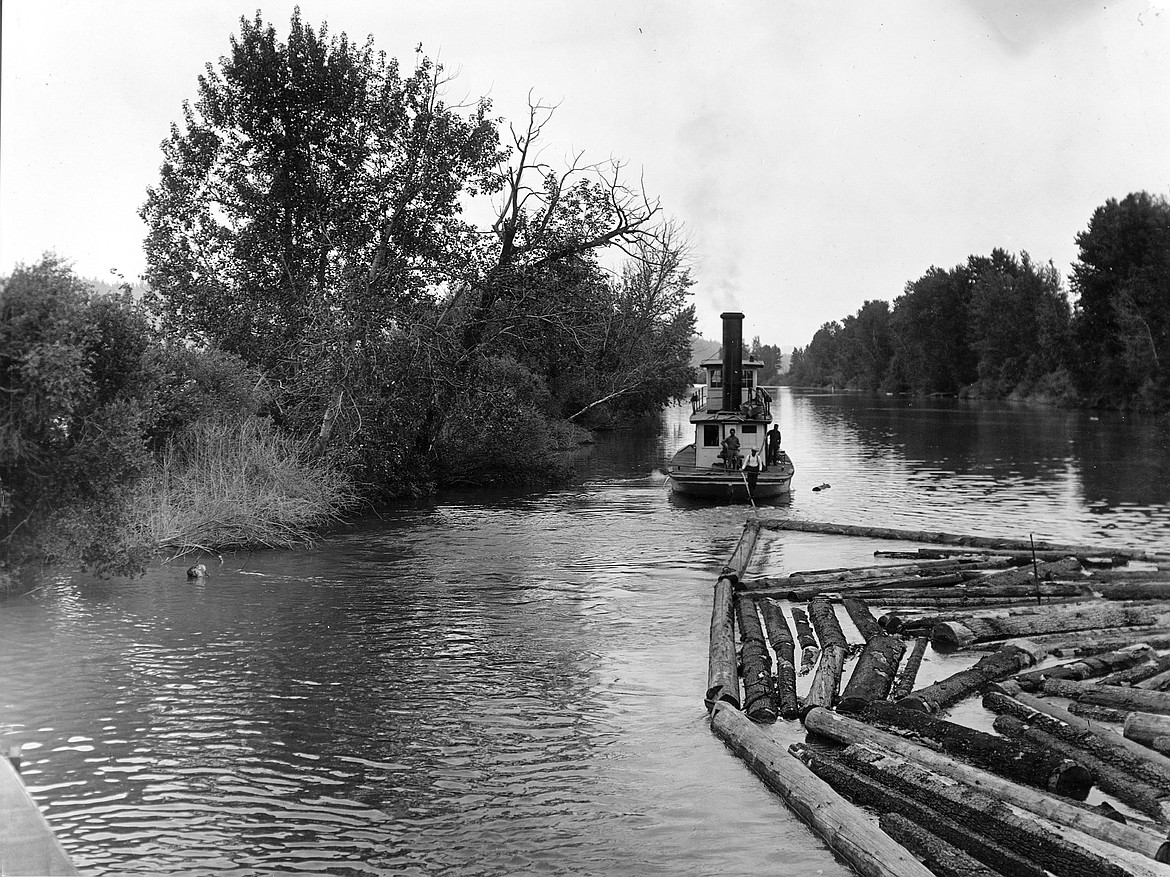 Photo courtesy of Museum of North Idaho 
A tugboat pulls a brail of logs down the St. Joe River to Lake Coeur d&#146;Alene.