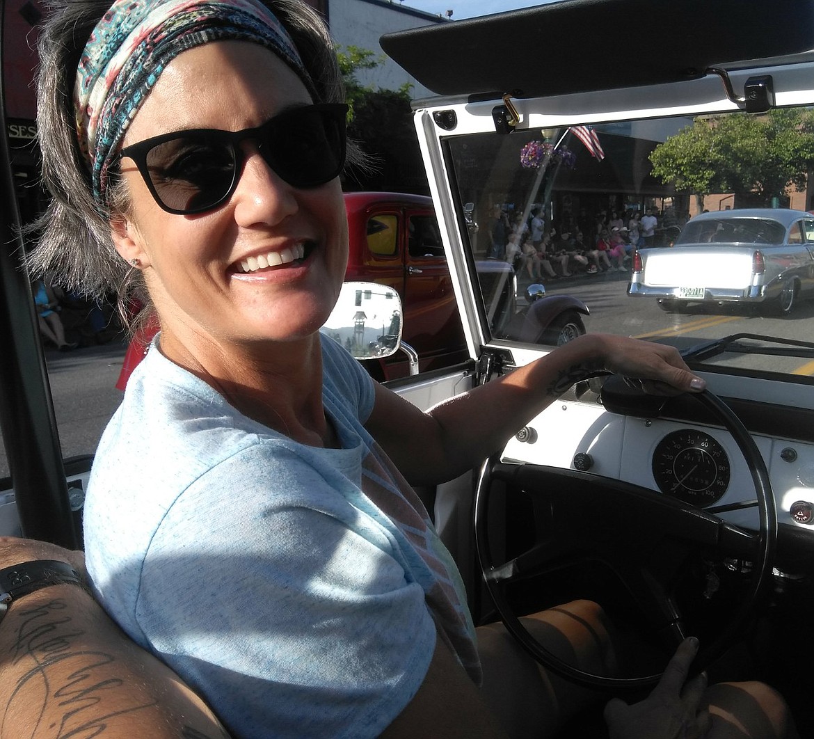 Shelley Hurtado takes the wheel in her 1973 Volkswagon Thing during Friday's Car d'Lane Cruise. (CRAIG NORTHRUP/PRESS)