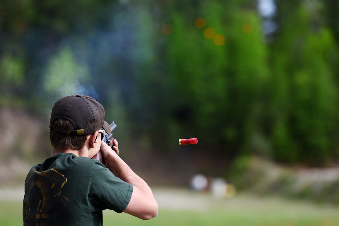 Cody Martin hits a target while trap shooting at Bigfork Gun Club on Tuesday, May 21. (Casey Kreider/Daily Inter Lake)