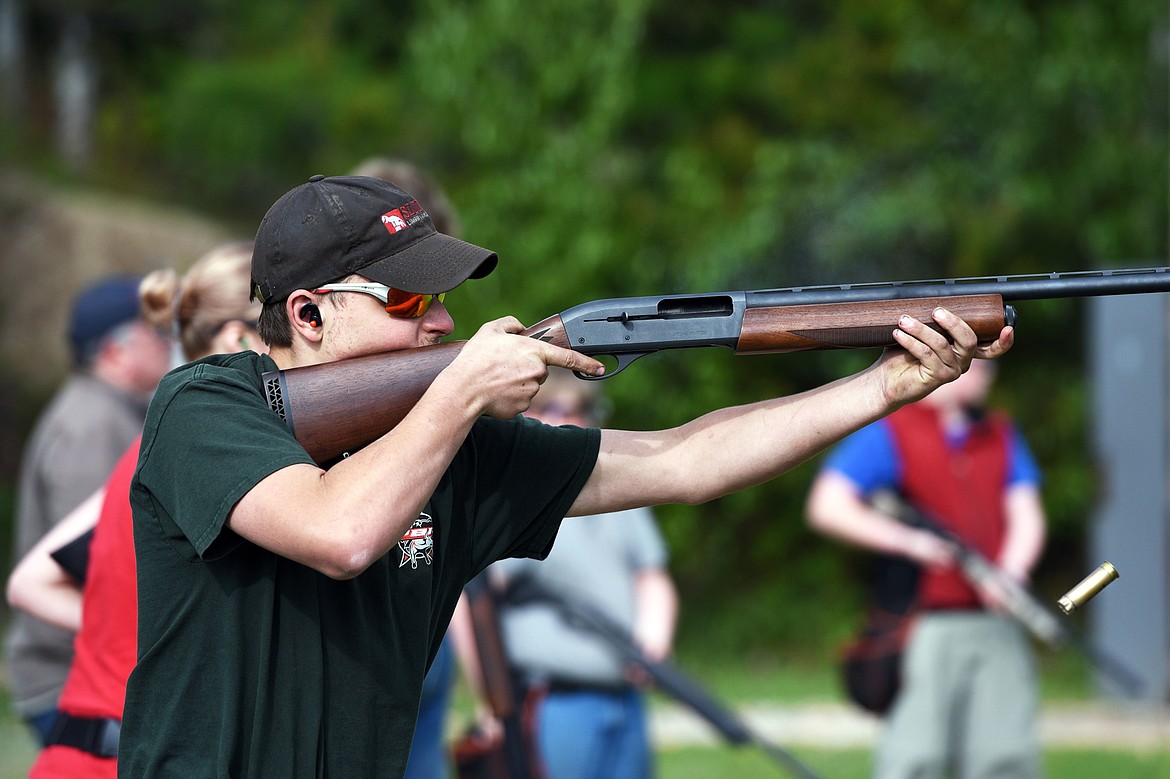 Cody Martin fires at a target while trap shooting at Bigfork Gun Club on Tuesday, May 21. (Casey Kreider/Daily Inter Lake)