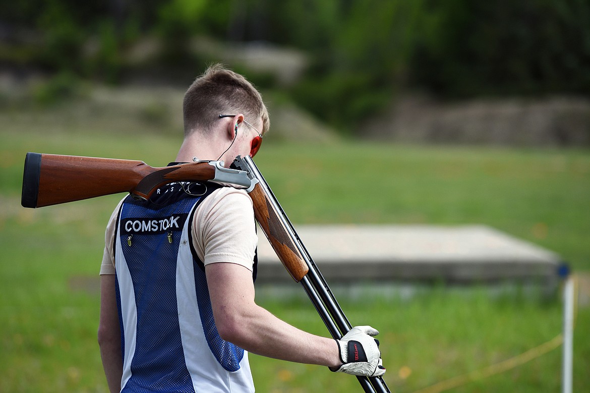 Luke Comstock takes a break between rounds of trap shooting at Bigfork Gun Club on Tuesday, May 21. Comstock, a recent college graduate, was one of the first members to join the Bigfork Competitors when it started in 2013. (Casey Kreider/Daily Inter Lake)