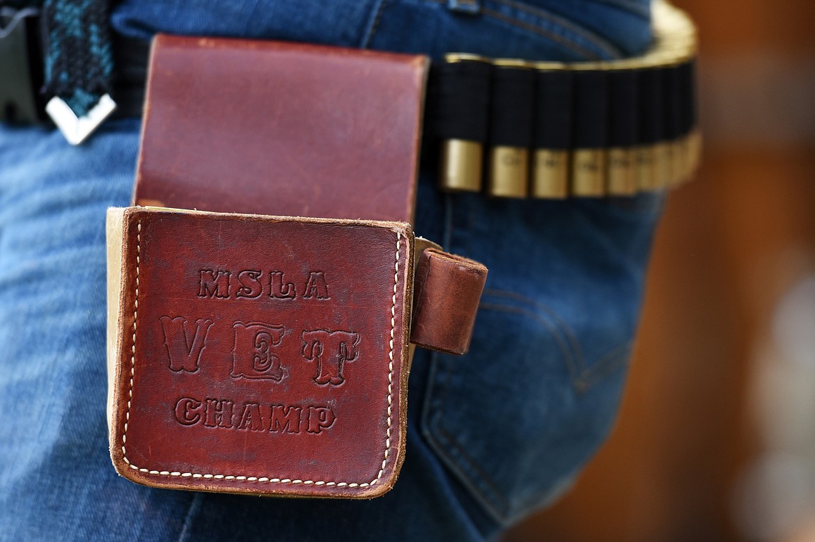 A shooter wears a custom leather pouch for holding shells while trap shooting at Bigfork Gun Club on Tuesday, May 21. (Casey Kreider/Daily Inter Lake)