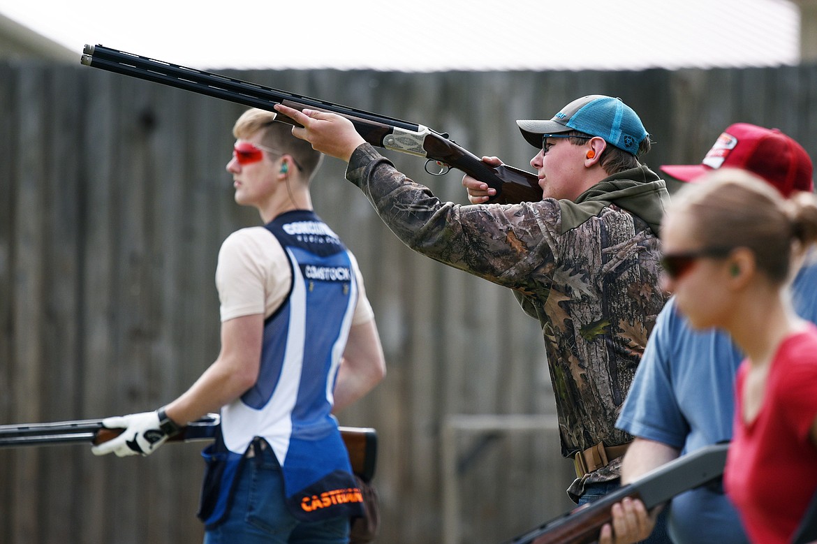 Shooters line up and take turns firing at targets during a round of trap shooting at Bigfork Gun Club on Tuesday, May 21. (Casey Kreider/Daily Inter Lake)