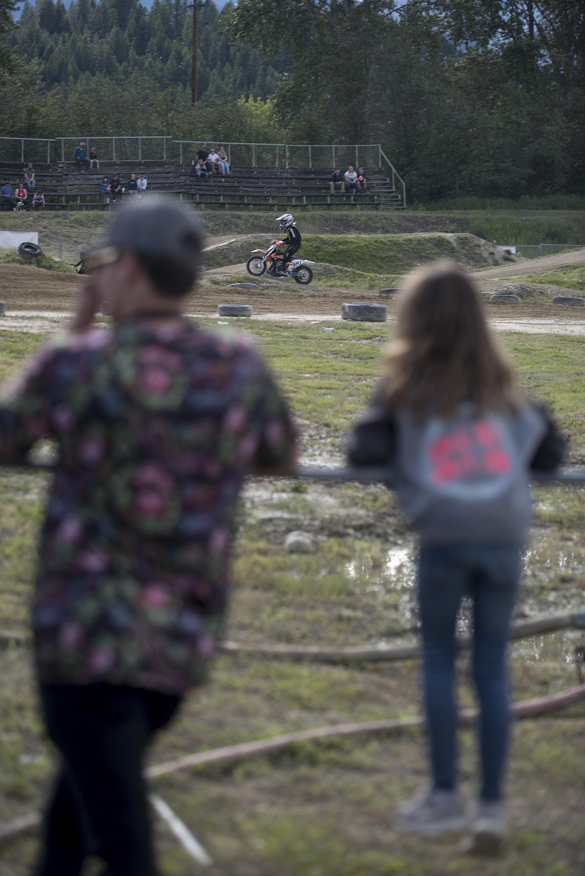 Fans watch as racers compete in the Millpond Motocross race, Saturday in Libby. (Luke Hollister/The Western News)
