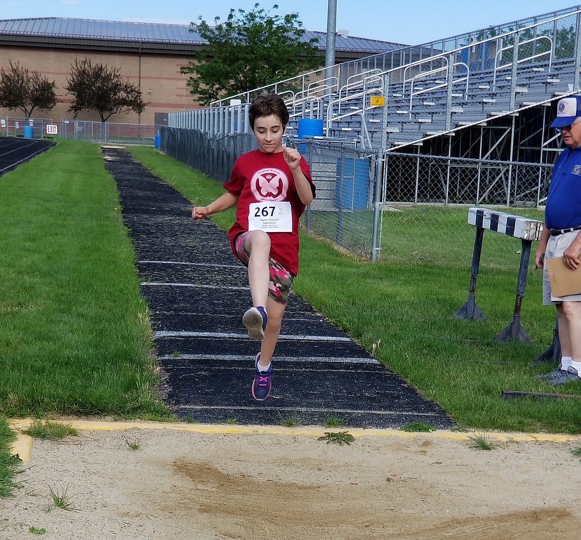 (Photo courtesy of CHRIS PAINTER)
Hayley Thompson competes in the running long jump, in which she placed third.