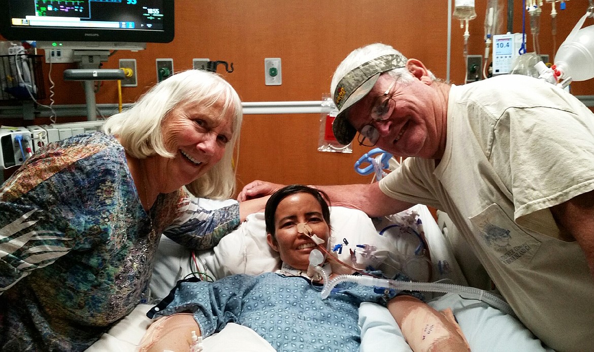 Courtesy photo
Double-lung transplant patient Jen McKenna, of Coeur d&#146;Alene, is seen here with dad Duane Ellis and stepmom Sally Ellis on June 4, 12 days after her operation at the University of North Carolina Chapel Hill. Complications followed the transplant, but Jen is in recovery and could be home as early as late September.