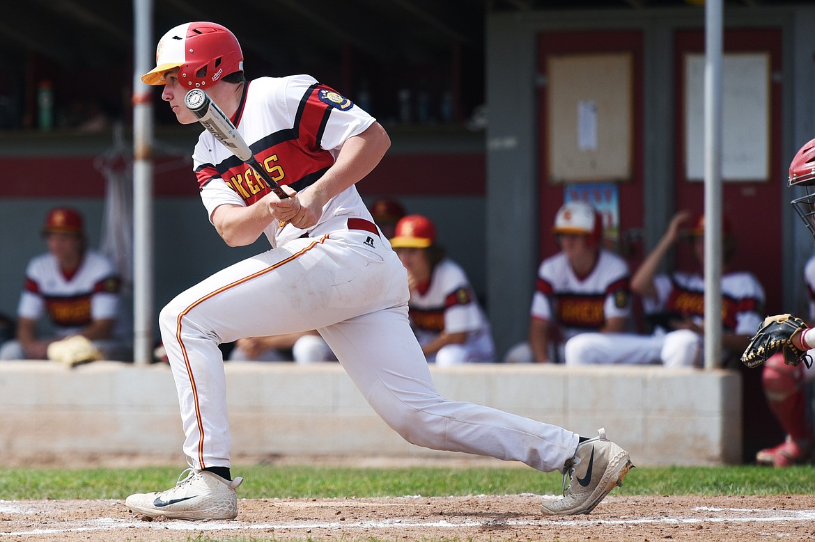 Kalispell's Hank Nuce rips a two-run single in the Lakers A's 12-run second inning against the Cranbrook Bandits A at Griffin Field on Wednesday. (Casey Kreider/Daily Inter Lake)