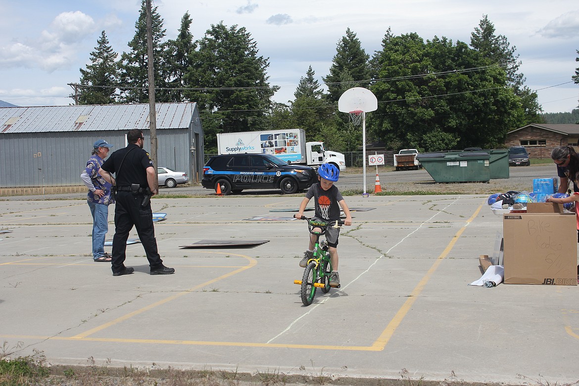 School Resource Officer Travis Stolley and former Superintendent Gary Pfleuger assisted with the event.