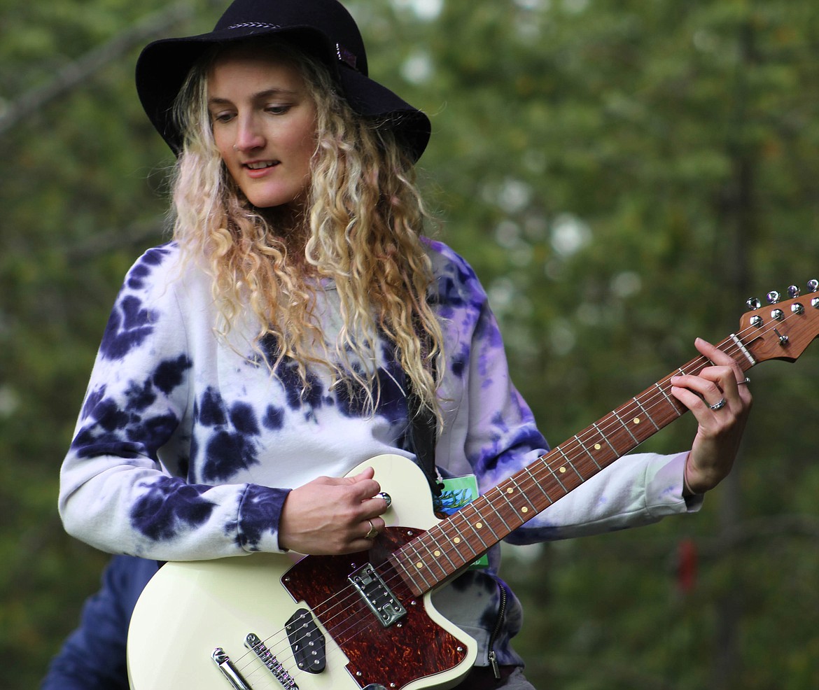 MADELINE KELLY plays the guitar at the Campout.