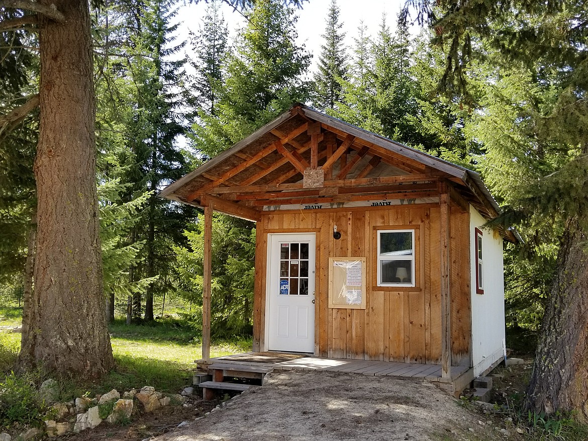 VOLUNTEERS MAINTAIN the library, which is on the schoolhouse property. It was built from the old DeBorgia Post Office. (Courtesy photo)