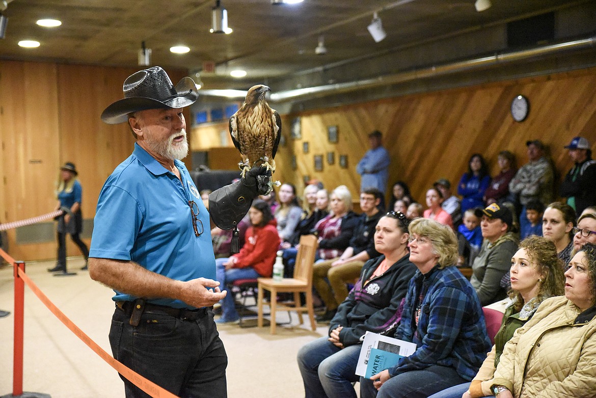 Don Veltkamp with Birds of Prey Northwest shows audience members a red-tailed hawk, at Birds of Prey Day May 25. (Ben Kibbey/The Western News)