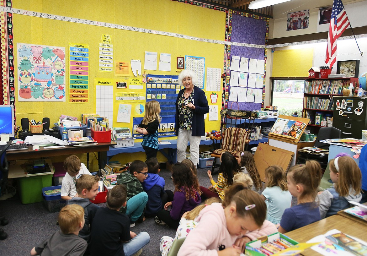 First-grade teacher Paula Hearn goes through calendar dates with her final class of students on the last day of school Thursday at Ponderosa Elementary. Hearn is retiring after 44 years with the Post Falls School District, 42 of those years at Ponderosa. (DEVIN WEEKS/Press)