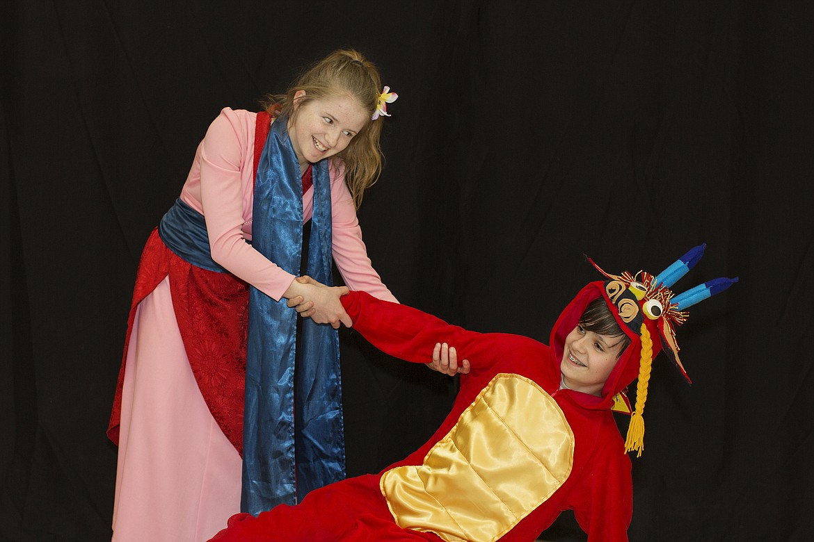 In this March 2019 file photo, Brenna Ernst plays the role of Mulan and Dawson Girardot, Mushu the Dragon, in Kalispell Middle School&#146;s production of &#147;Mulan Jr.&#148; Under Strong&#146;s tutelage the students helped make the costumes. (Photo provided).