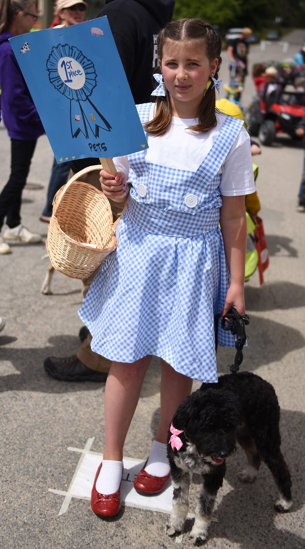 ONE OF the most recognizable costumes in the parade was worn by Brielle Clarke of Kalispell. She was dressed as Dorothy from the Wizard of Oz, with her dog Toto. She won first place in the Pets category.