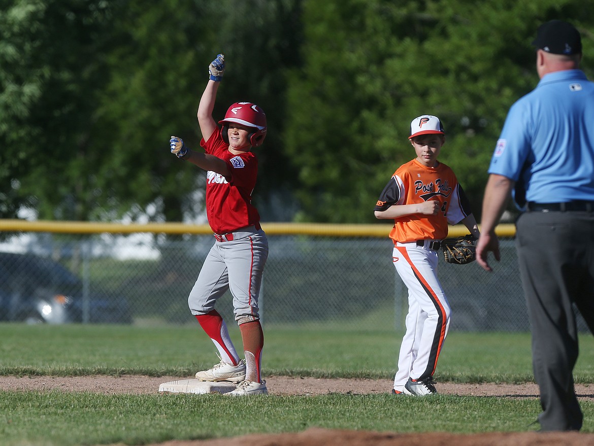 Hayden&#146;s Harrison Evans celebrates an RBI double in a Little League District 1 Majors tournament game against Post Falls on Friday at the Canfield Sports Complex in Coeur d&#146;Alene. (LOREN BENOIT/Press)