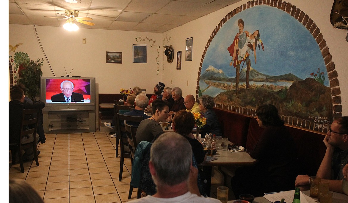 A crowd of Kootenai County Democrats flocked to Las Chevalas in Coeur d'Alene Thursday night to watch Vermont Sen. Bernie Sanders (on screen) compete among 20 candidates in the party's first debate. (CRAIG NORTHRUP/Press)