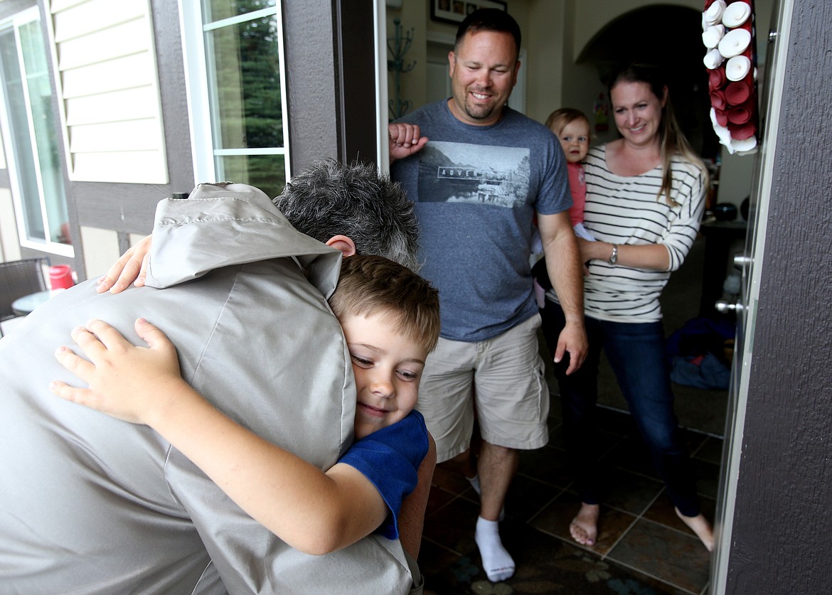 LOREN BENOIT/Press
Camdyn Thompson, a 7-year-old from Post Falls, hugs Ellen Brown after she presented Camdyn and his family with a $5,000 check to cover the amount left needed to purchase a dog. Camdyn, who has Type 1 diabetes, has been raising money with his lemonade stand to buy a specially-trained medical alert dog that can tell if he has a blood sugar level that is too high or too low. Also pictured are Wade and Terina, and Camdyn&#146;s sister Adalina.