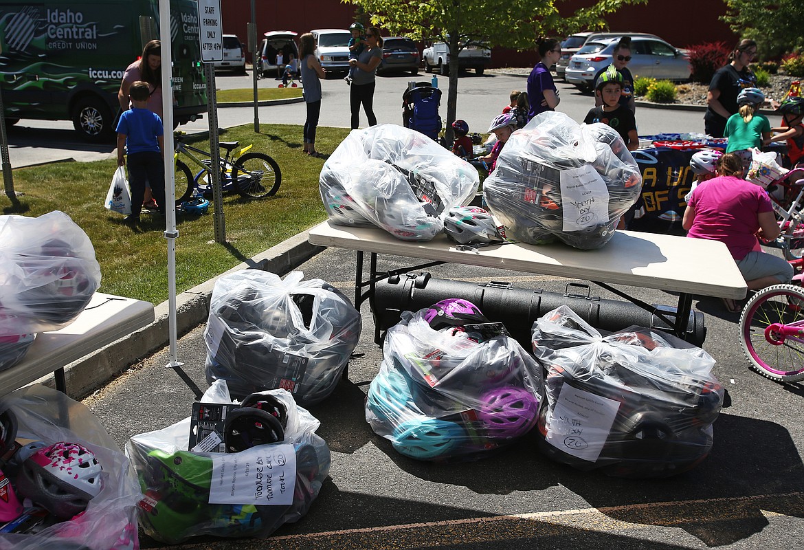 Around 200 helmets, granted through the Kootenai Foundation, were given to local area kids at Hayden's Bike Rodeo Event Wednesday at the Hayden Library. (LOREN BENOIT/Press)