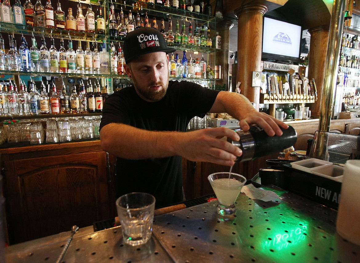 LOREN BENOIT/Press
Bartender Kyle Graves makes a lemon drop cocktail for a customer at Cricket&#146;s Oyster Bar and Grill on Monday. The inaugural Idaho Craft and Spirits Festival starts at 5 this evening.