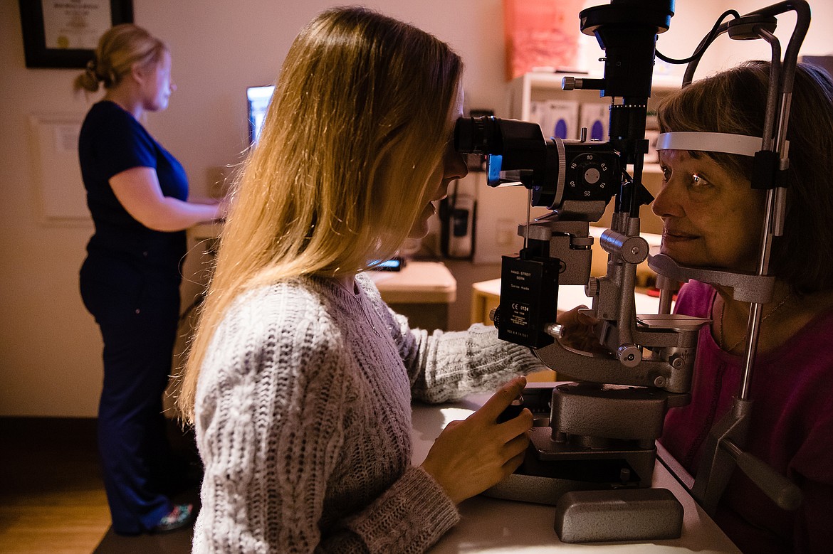 Photo by JEROME POLLOS PHOTOGRAPHY
Dr. Sara Duke performs a post cataract surgery follow-up on Jan Baker at the North Idaho Eye Institute in Coeur d&#146;Alene.