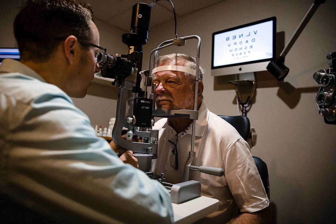 Dr. David Dance performs a post surgery follow-up on Jim Wynne at the North Idaho Eye Institute in Coeur d&#146;Alene.