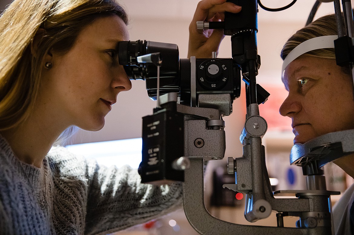 Dr. Sara Duke performs a post surgery follow-up on Gwynne Fleener at the North Idaho Eye Institute in Coeur d&#146;Alene.