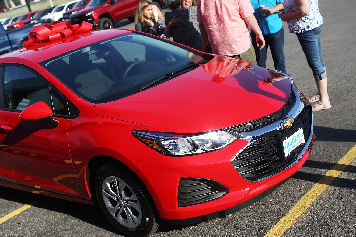 Photos by LOREN BENOIT
Timberlake High School grad Kenzie Dean drew the winning key for this 2019 Chevy Cruze at Knudtsen&#146;s car giveaway and 80th anniversary party.