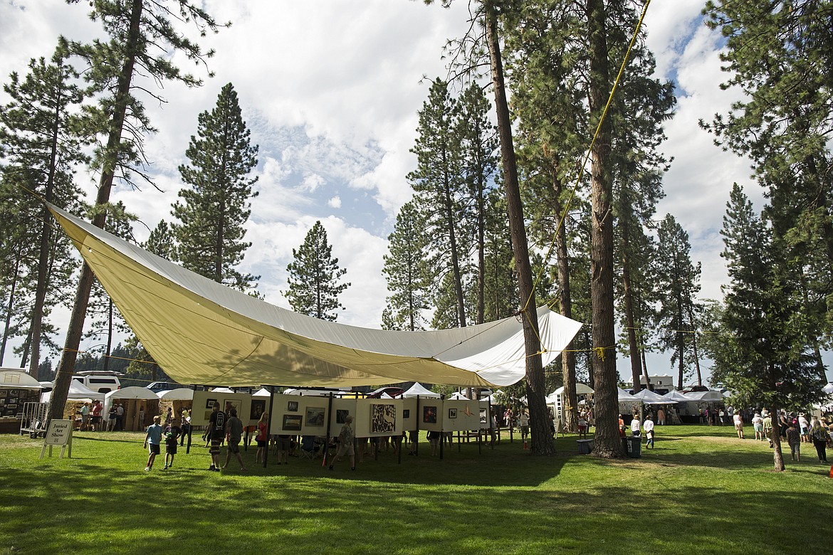 Residents mingle around the juried art show tent at North Idaho College during Art on the Green in 2016. (LOREN BENOIT/Press File)