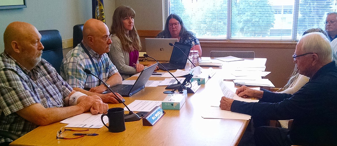 Coeur d'Alene resident Jim Crowe, right, appeals his property assessment to the Board of Equalization on Monday. Board members from left include Bill Brooks, Chris Fillios and Leslie Duncan. The three are also county commissioners. Crowe's appeal, which was unanimously denied by the board, kicked off two weeks of property assessment appeal hearings. (BRIAN WALKER/Press)