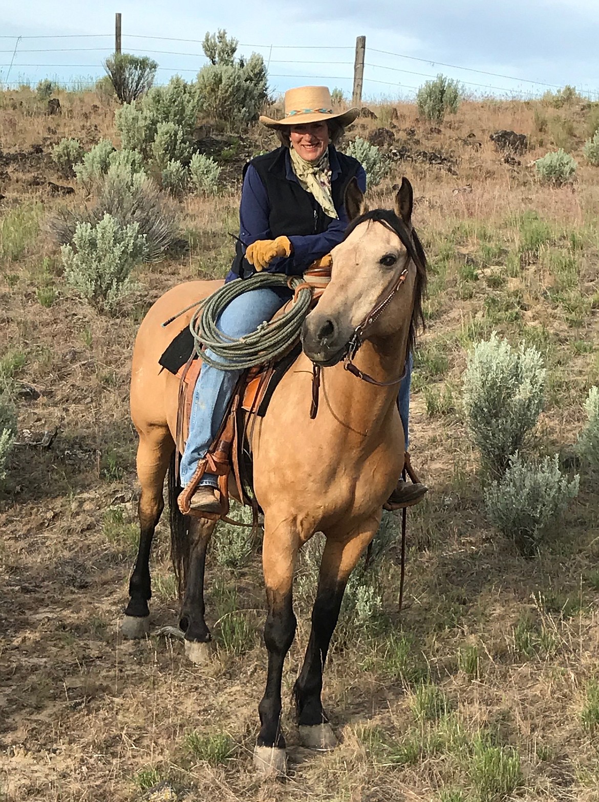 Photo courtesy of Jennifer Ellis 
Jennifer Ellis, along with her horse, west of Blackfoot near the Big Southern Butte. Ellis started Idaho Conservatives as a media outlet to counter alt-right sites that demonize fellow Republicans.