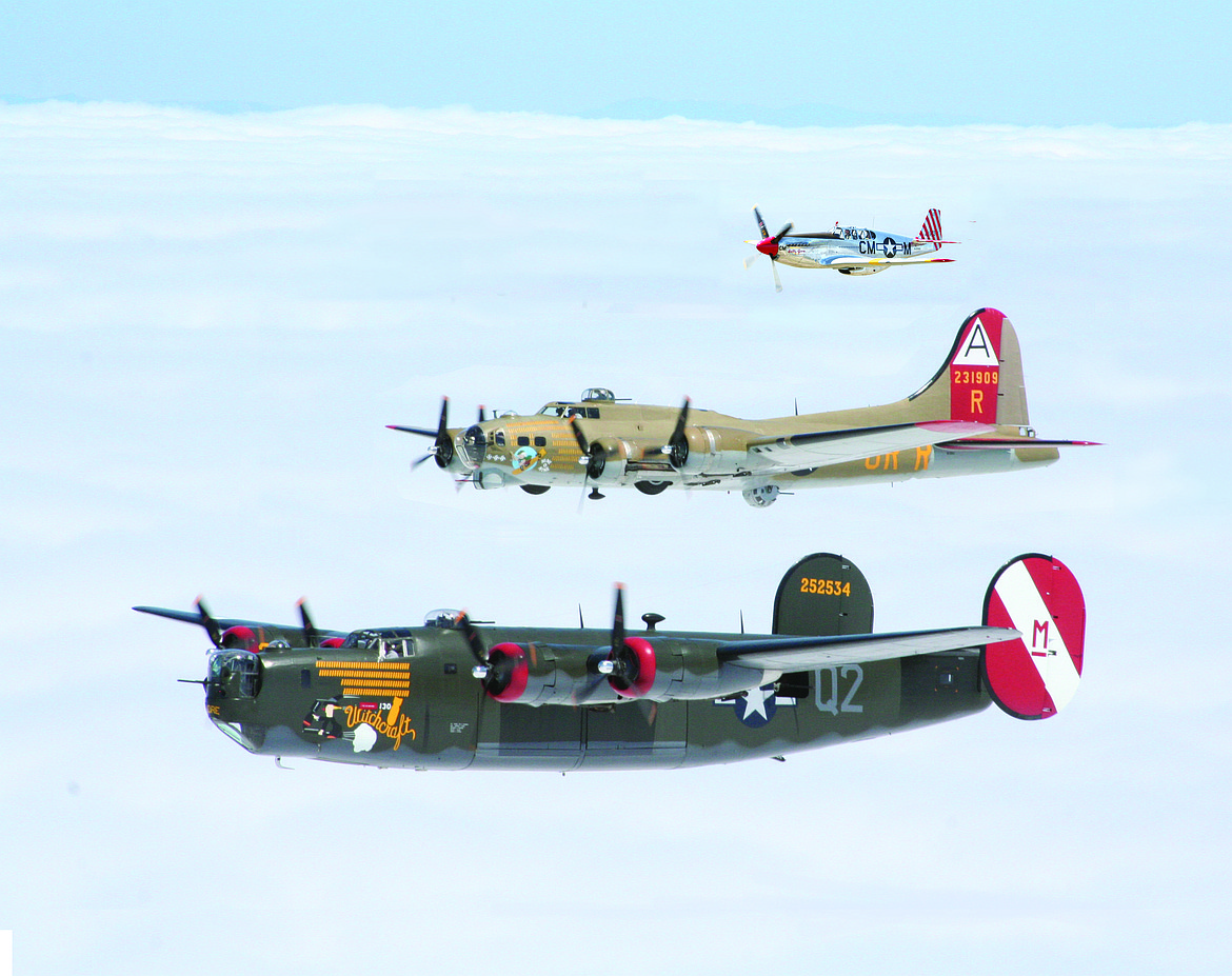 A B-24 Liberator, B-17 Flying Fortress and P-51 Mustang fly in formation. (Photo courtesy of The Collings Foundation)