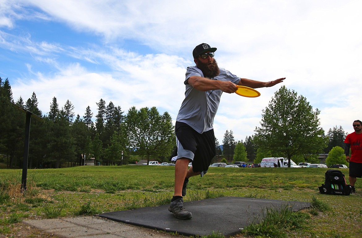 Cody Hixson hurls a disc off the first hole tee during a disc golf tournament Wednesday, June 12, 2019 at Cherry Hill. (LOREN BENOIT/Press)