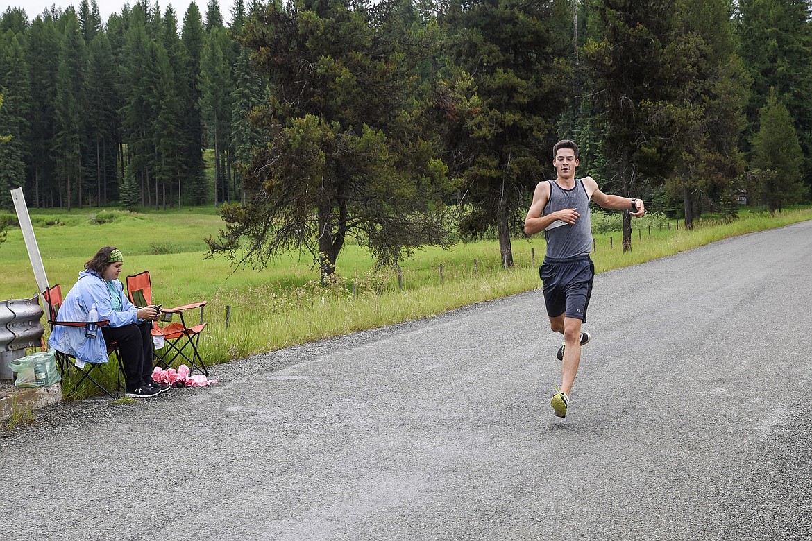 John Cheroske is the first across the finish line in 25:03 at the 2019 Sasquatch Run at the annual Yaak Sasquatch Festival, a full minute ahead of sasquatch. (Ben Kibbey/The Western News)