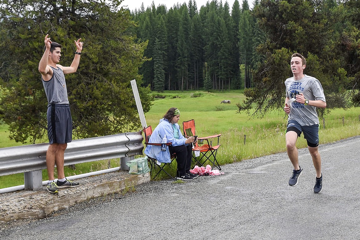 The second across the finish line in 25:13, William O&#146;Conell is cheered on by first-place finisher and fellow Logger John Cheroske at the 2019 Sasquatch Run during the annual Yaak Sasquatch Festival. (Ben Kibbey/The Western News)