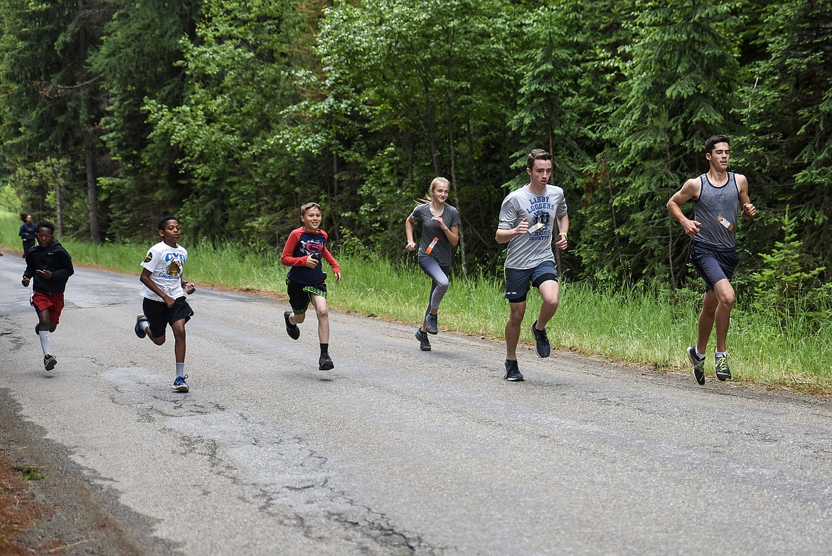 With Logger athletes John Cheroske (far right), Will O&#146;Connell and Rylee Boltz already in the lead, the youngest runners tear off after sasquatch during the 2019 Sasquatch Run at the annual Yaak Sasquatch Festival (Ben Kibbey/The Western News)