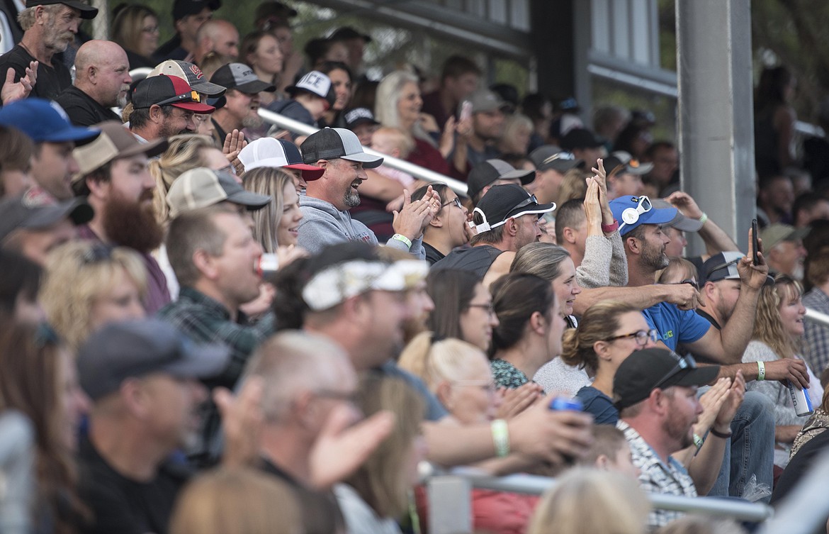 Fans cheer competitors on during the Bull/Bullette of the Woods competition at Libby Logger days, Saturday in J. Neils Memorial Park. (Luke Hollister/The Western News)