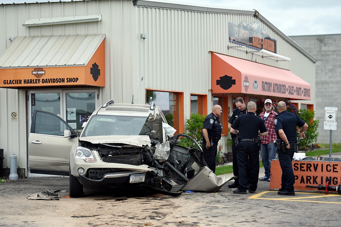 Kalispell police work the scene of a three-vehicle crash in the 2400 block of U.S. 93, south of Kalispell on Saturday. According to witnesses, six people were transported from the scene via ambulance with one adult and one child transported in critical condition. Flathead County Sherriff's Office, South Kalispell Fire, Kalispell Fire, Kalispell Police, Smith Valley Fire and Montana Highway Patrol all responded to the crash. (Casey Kreider/Daily Inter Lake)